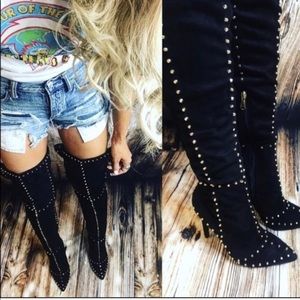 Thigh high black boots with gold studs